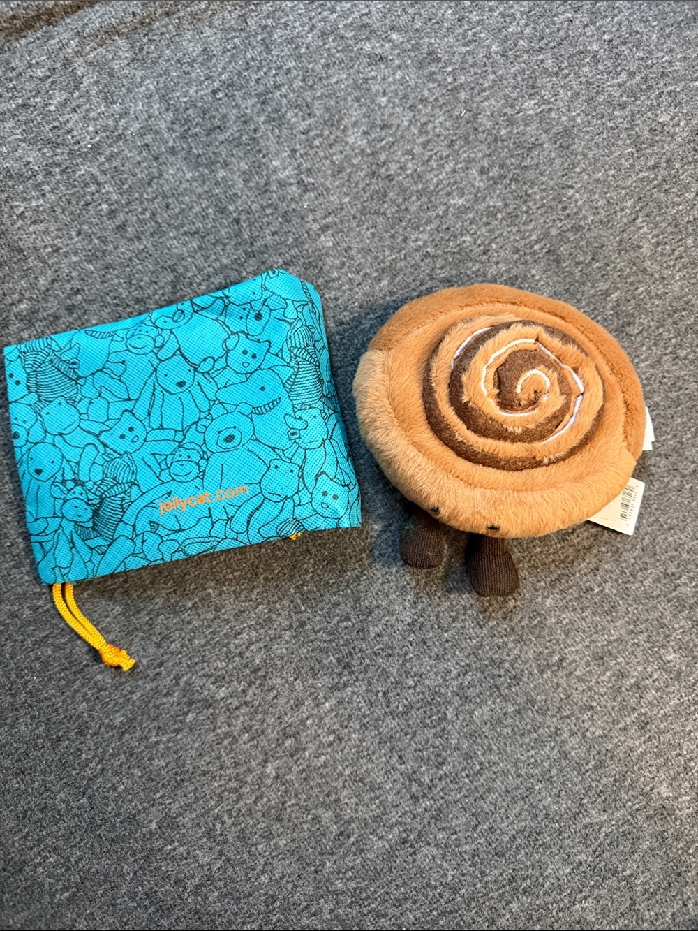 Jellycat Brown Plush Cinnamon Roll Stuffed Toy with Teal Pouch